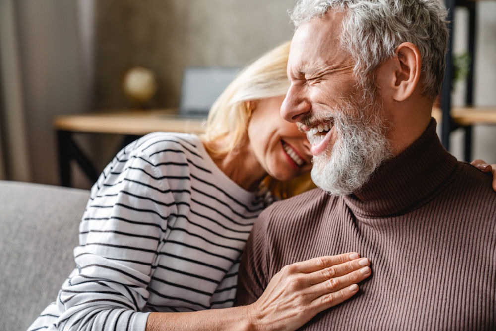 man and woman in a relationship sitting together and smiling