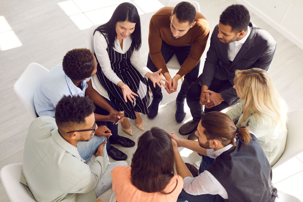 group of people in addiction recovery in a group therapy session