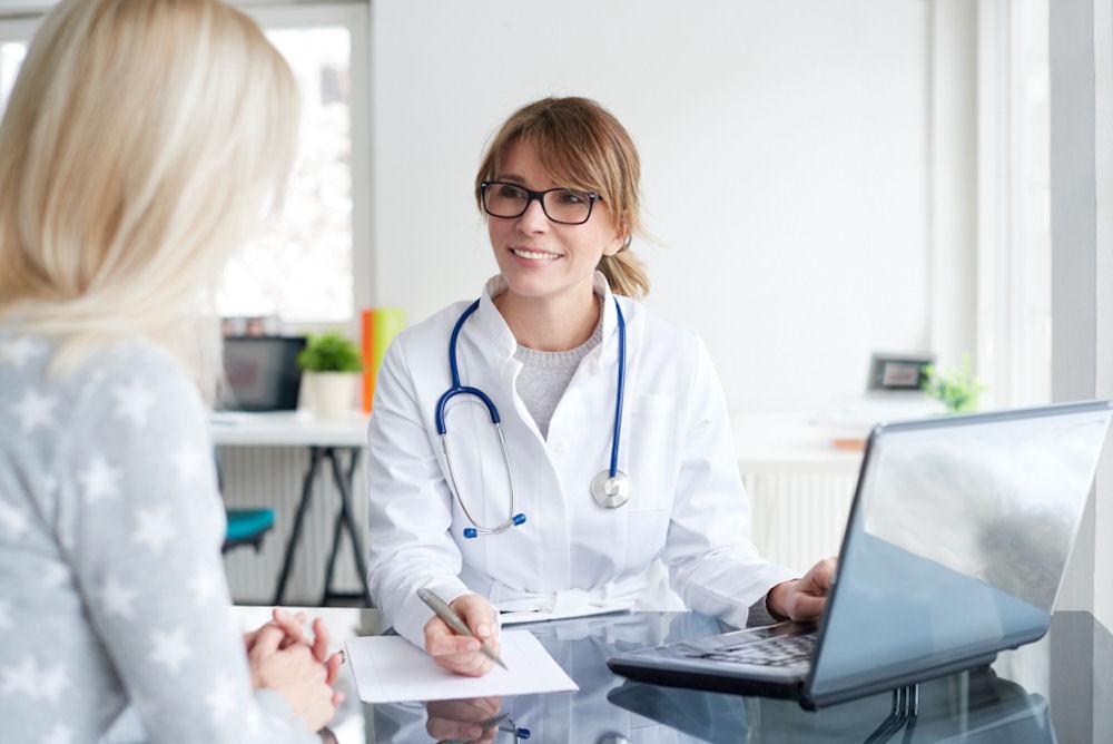 doctor speaking with patient