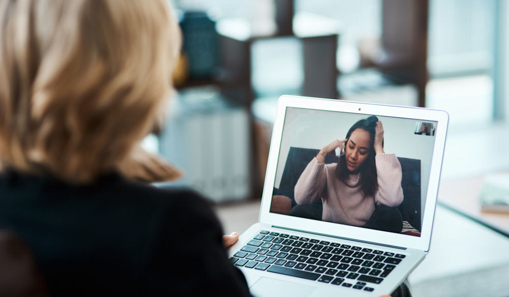 therapist using laptop for telehealth call