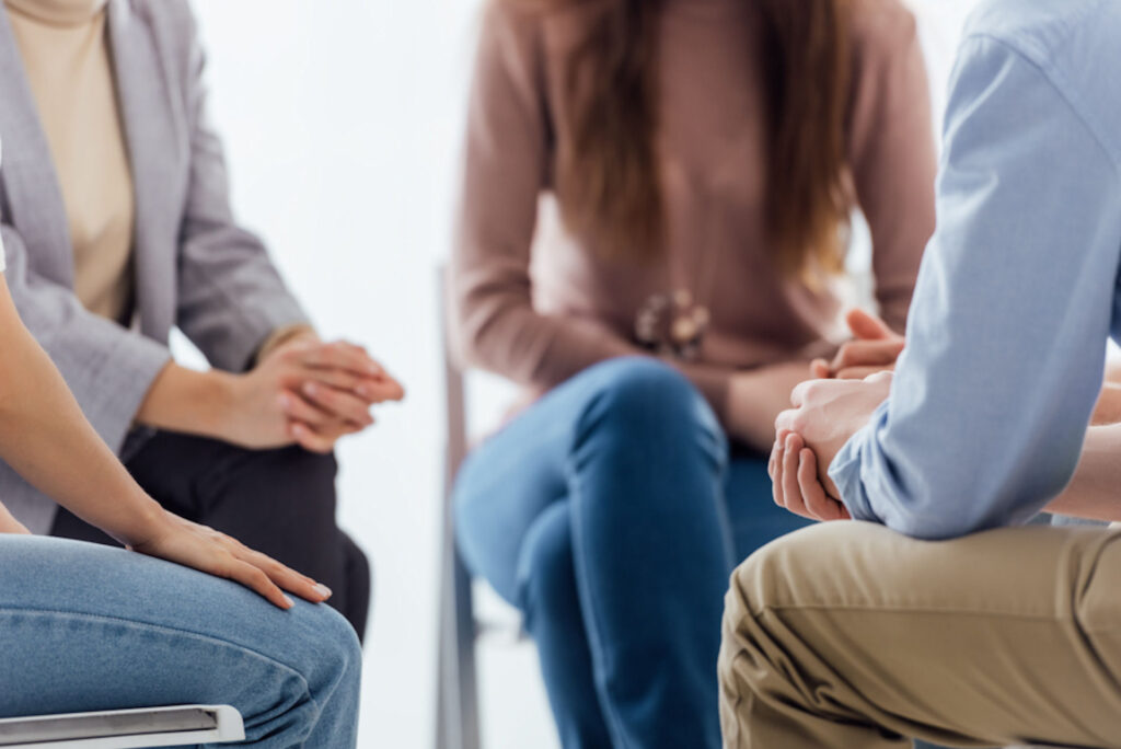 small group sittin in a circle to have a discussion