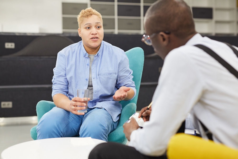 counselor and their client having a discussion in individual therapy