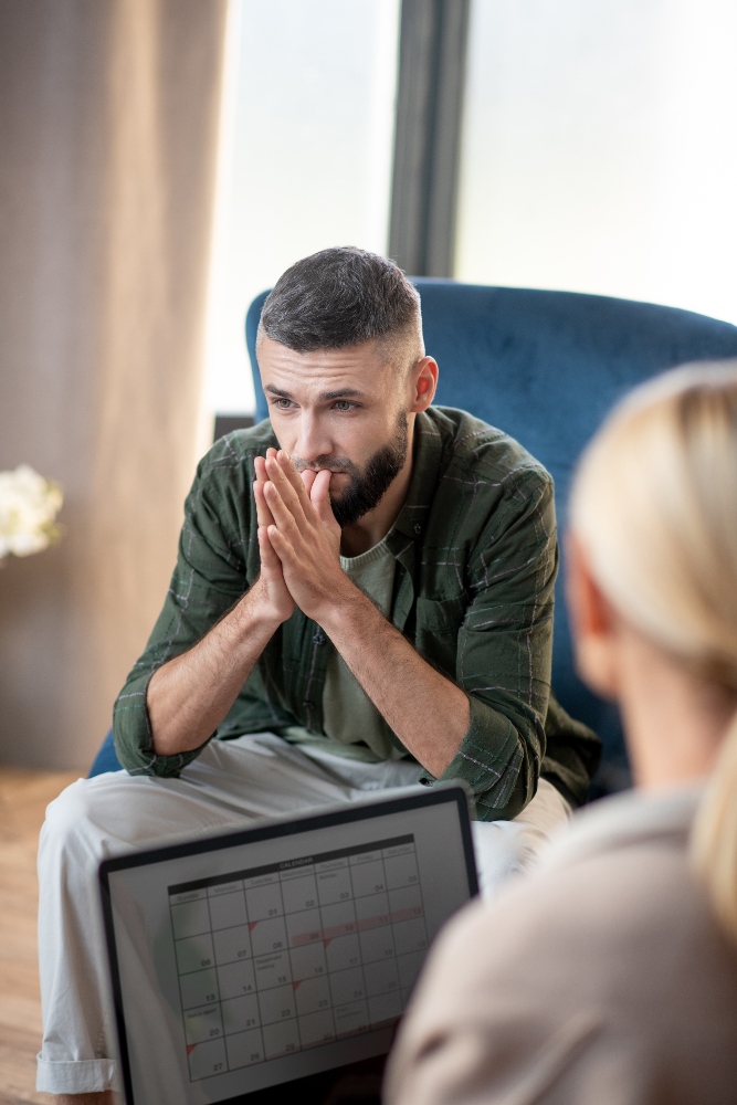 man-coming-to-psychologist-after-divorce-with-wife-2024-10-18-05-49-58-utc (2) (1) man speaking with therapist about addiction in colorado