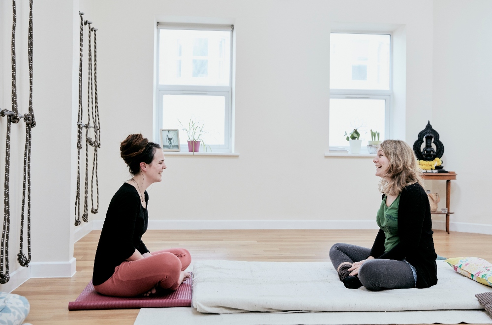 two women in a yoga therapy class