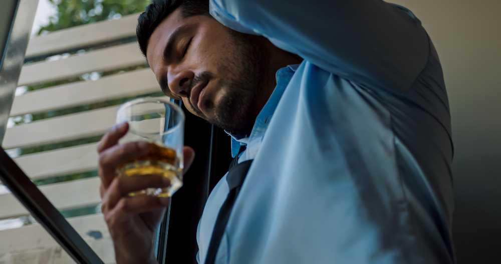 man drinking alcohol