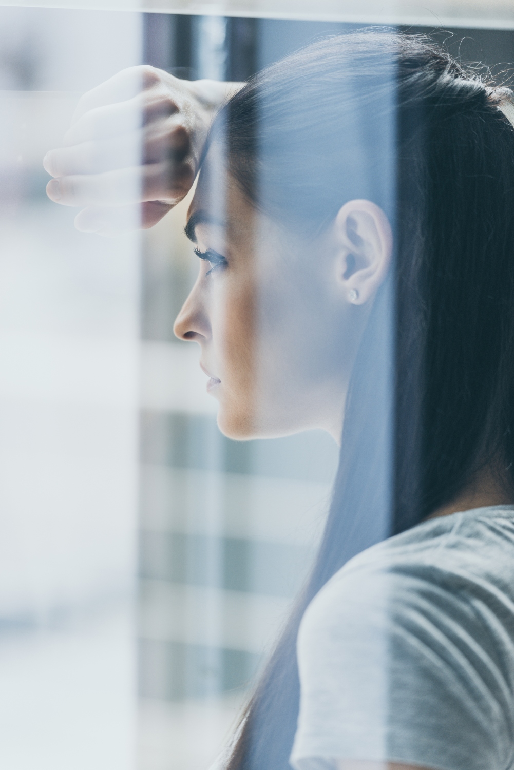 woman looking out window